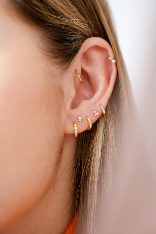 The Charm of Solid Gold Piercings: What Makes Them Great for Ear Jewelry
